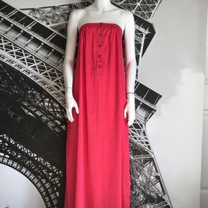 Hot Pink strapless maxi dress with gold buttons.